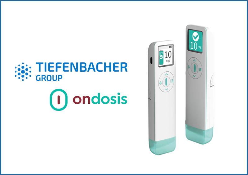 Tiefenbacher Group - Two white and teal handheld medical devices with digital displays showing “10 mg,” next to the Tiefenbacher Group and Ondosis logos, highlight advanced pharmaceutical healthcare solutions for finished dosage forms on a white background.