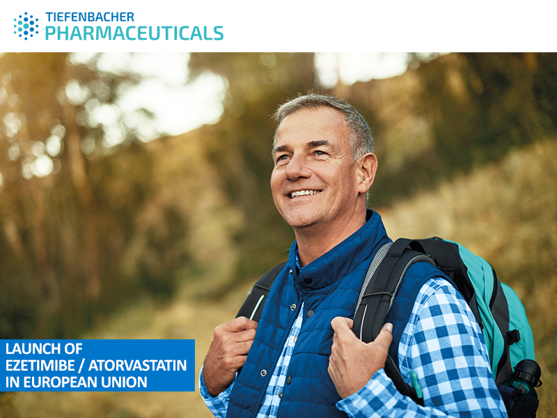 Tiefenbacher Group - Smiling older man outdoors, wearing a blue vest and carrying a backpack. Text: "Launch of Ezetimibe / Atorvastatin in European Union." Family-owned pharmaceutical company focused on patient-centric drug development. TIEFENBACHER PHARMACEUTICALS logo at the top.