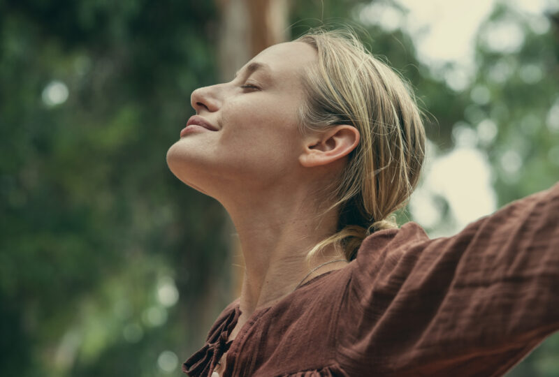 Woman breathing fresh air outdoors